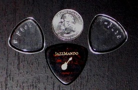 Medium Rounded on the left, Large Rounded on the right, with USA quarter and JazzMando pick for persepective.